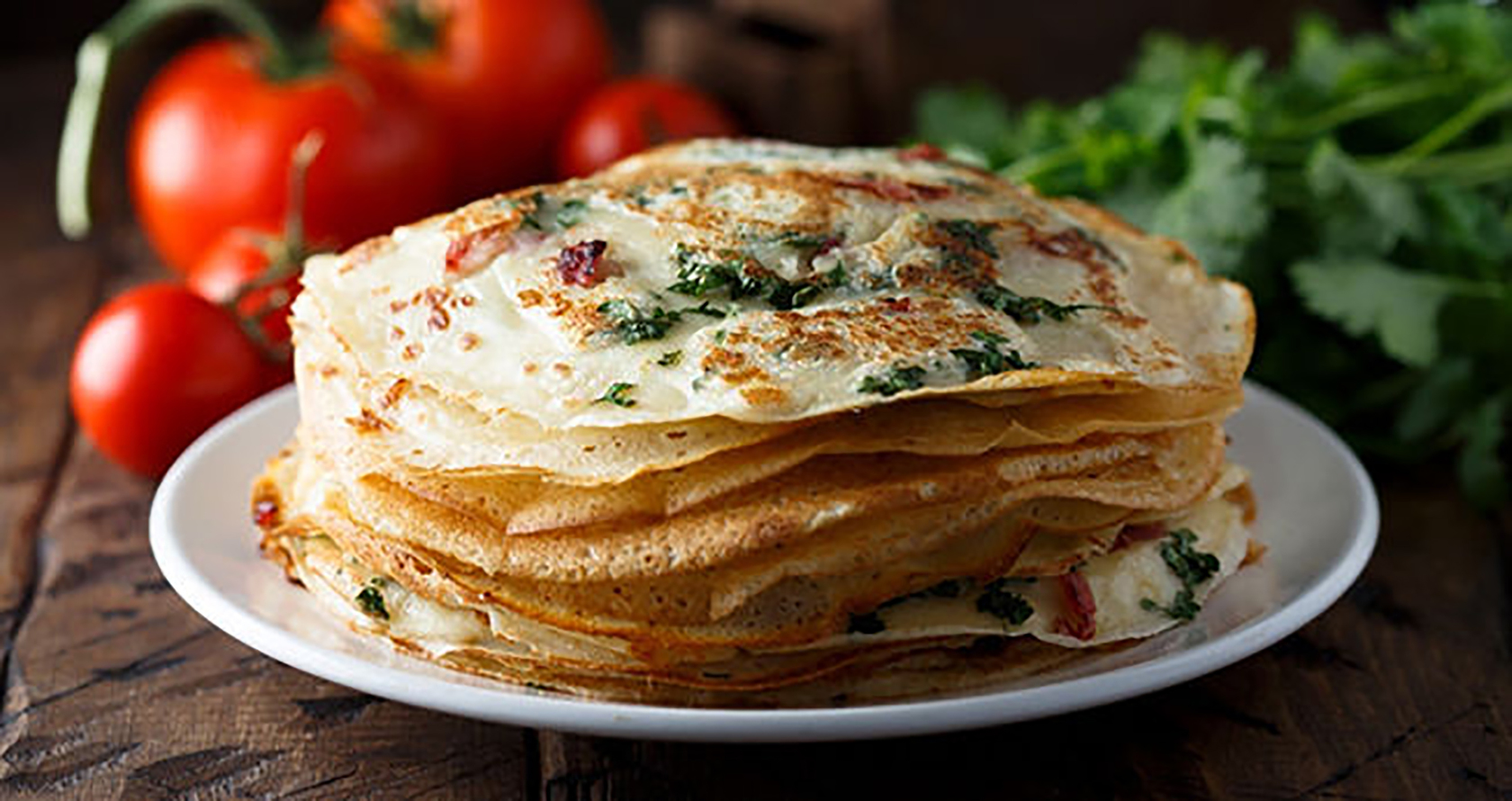 Directions:  Mix chickpea flour with water and egg Add the rest of the ingredients Cook pancakes on an iron skillet until light brown Serve with chutney or eat plain